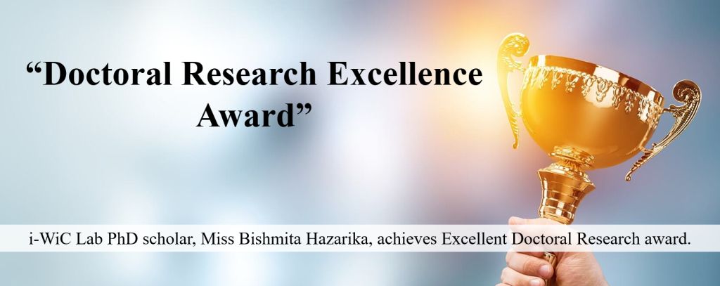 Announcement graphic with a trophy: “Doctoral Research Excellence Award” — i-WiC Lab PhD scholar Miss Bishmita Hazarika achieves Excellent Doctoral Research award.
