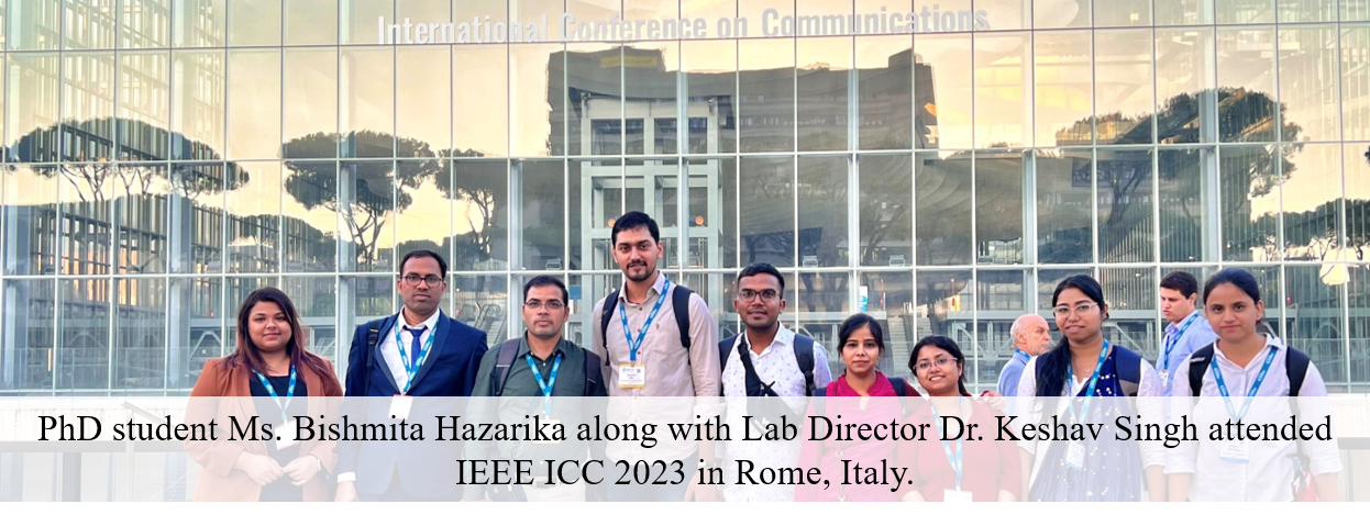 Group photo of conference attendees, including i-WiC Lab members, in front of the International Conference on Communications venue in Rome.