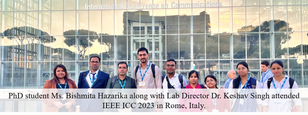 Group photo of conference attendees, including i-WiC Lab members, in front of the International Conference on Communications venue in Rome.